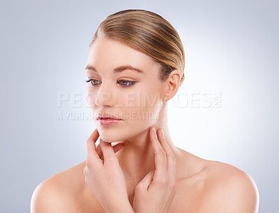 Buy stock photo Beauty shot of an attractive model touching her face