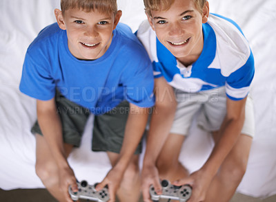 Buy stock photo Brothers, happy and portrait of video game in home, above and excited for online gaming in bedroom. Young children, smile and face for streaming sports on bed, bonding and relax together on weekend