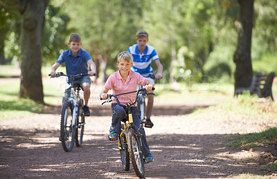 Buy stock photo Nature, happy and portrait of children on bicycle riding in outdoor field, park or forest for exercise. Fun, cycling and confident young boy kids on a bike for cardio, hobby or training in a garden.
