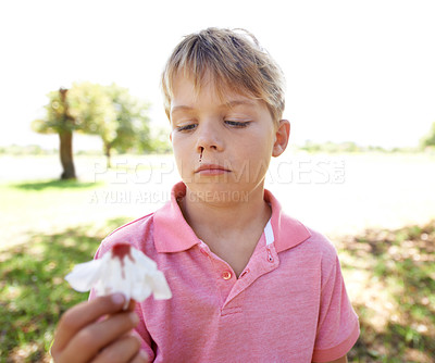 Buy stock photo A little boy with a nosebleed standing outside