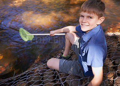 Buy stock photo Child, portrait and fishing net at river in nature for outdoor adventure or youth development, summer or countryside. Kid, boy and equipment for catch hobby in lake for learning, practice or skill