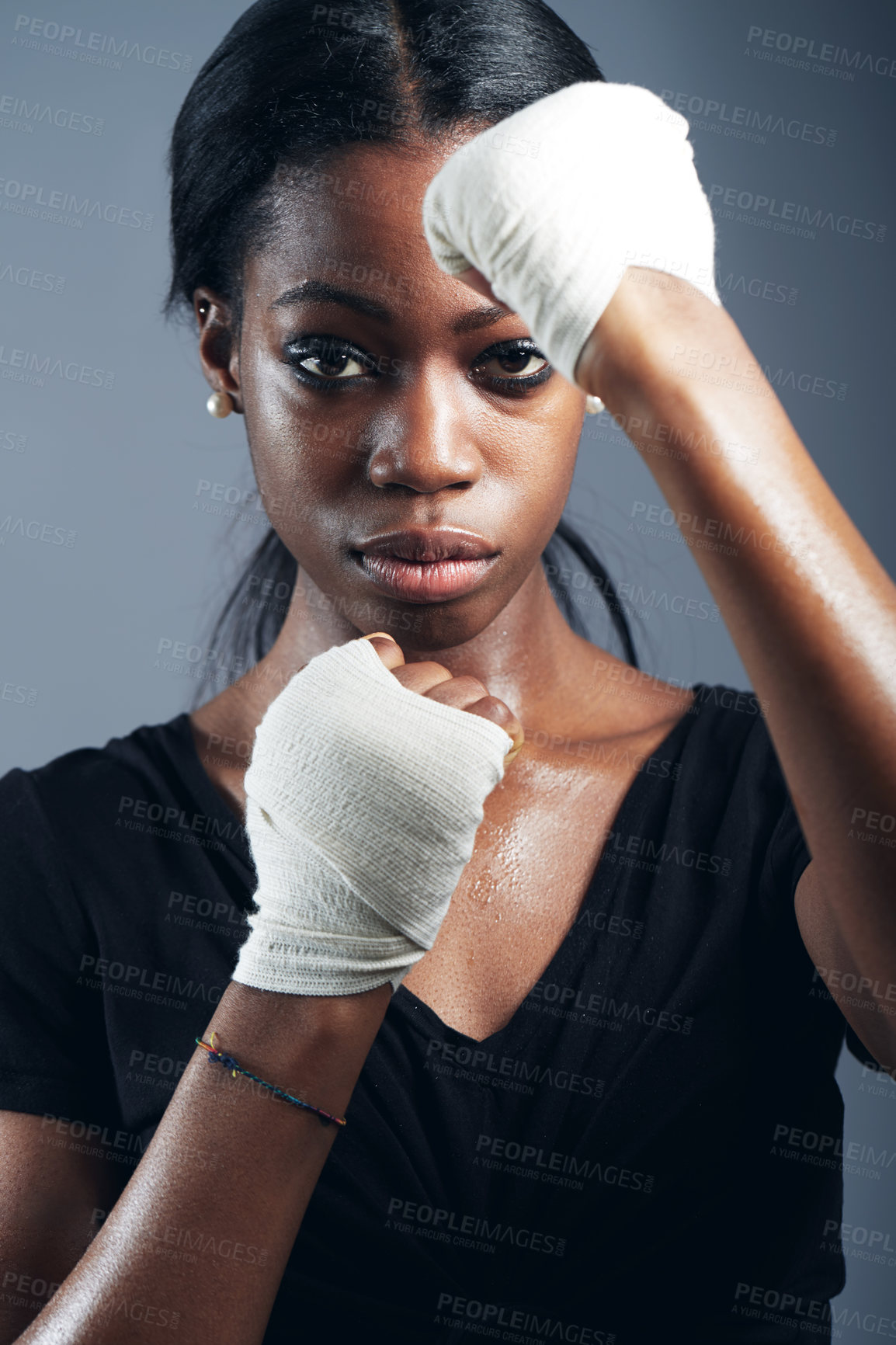 Buy stock photo Portrait, fighting and a woman boxer in studio on a gray background for self defense, fitness or training. Health, exercise and workout with a black female fighter practising for a boxing competition