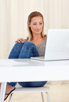 Buy stock photo Laptop, home and woman in home for remote work, freelance career and business in living room. House, desk and person on computer for online research, website blog and social networking for job