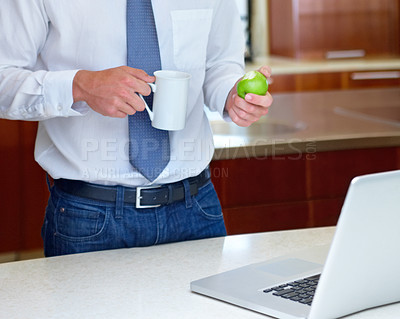 Buy stock photo Laptop, apple and hands of business man in home for morning routine, remote work and healthy breakfast. Wellness, worker and person with fruit on computer for website, research and internet in house