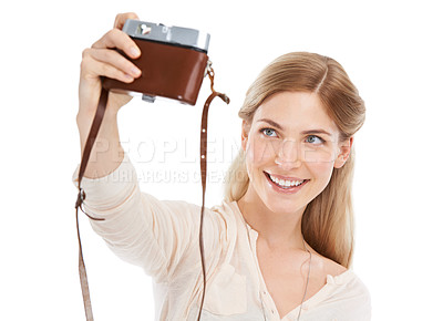 Buy stock photo Camera, selfie and happy woman in studio with fun hobby, memory or photoshoot on white background. Lens, face or female model smile for self portrait with vintage,  retro or photography equipment
