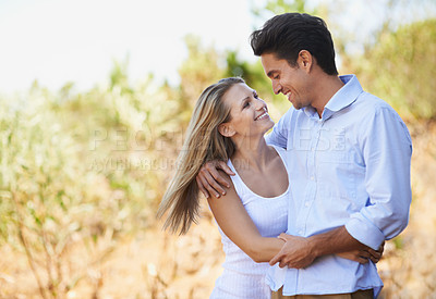 Buy stock photo Happy couple, hug and embrace in nature for bonding, love support for outdoor affection or comfort. Face of young woman and man hugging for embrace or peaceful romance in forest or woods together