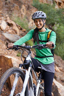 Buy stock photo Woman, mountain bike and portrait with smile, adventure and helmet for safety, fitness and health. Girl, bicycle and happy for training, race or challenge by hill, countryside or outdoor in Argentina