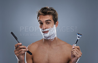Buy stock photo Man, portrait and shaving choice with cream in studio for razor, modern or retro grooming by grey background. Person, model and decision with beard, facial hair removal or product for cosmetic change
