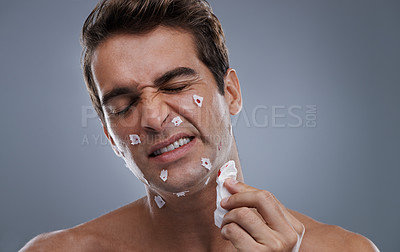 Buy stock photo Man, face and shave cuts in studio for hair removal hygiene or injury with blood, tissue or maintenance. Male person, grey background and dermatology with beard or clean health, wellness or mockup