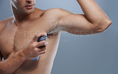 Buy stock photo Smell, wellness and man spray deodorant for hygiene, fragrance or fresh scent after shower on studio background. Perfume, product or model spraying armpit to prevent odor and mockup space with person