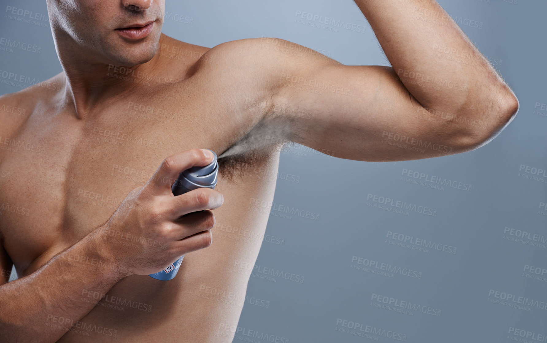 Buy stock photo Smell, wellness and man spray deodorant for hygiene, fragrance or fresh scent after shower on studio background. Perfume, product or model spraying armpit to prevent odor and mockup space with person