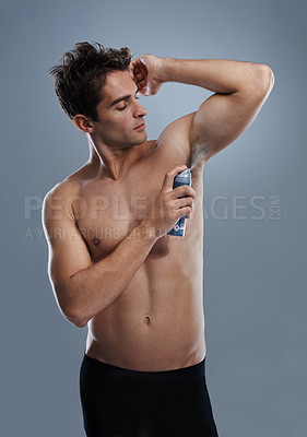 Buy stock photo Man, deodorant and cleaning armpit for smell in studio or product application for odor, hygiene or grey background. Male person, topless and confidence or health wellness, self care or mockup space