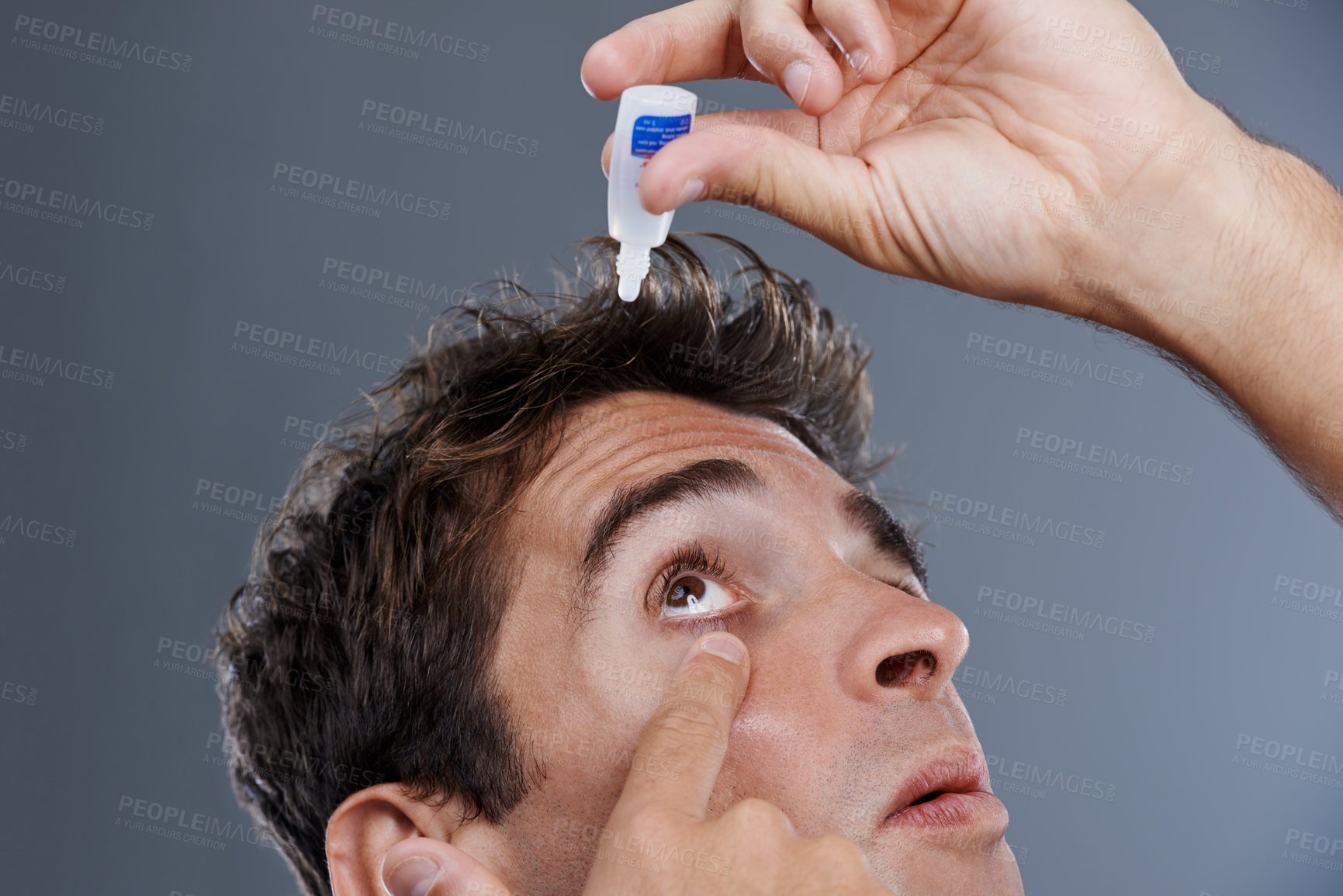 Buy stock photo Man, eye drops and vision for allergies or liquid in studio or healthcare wellness, dropper or grey background. Male person, solution and conjunctivitis for clean pupil or fluid, irritation or mockup