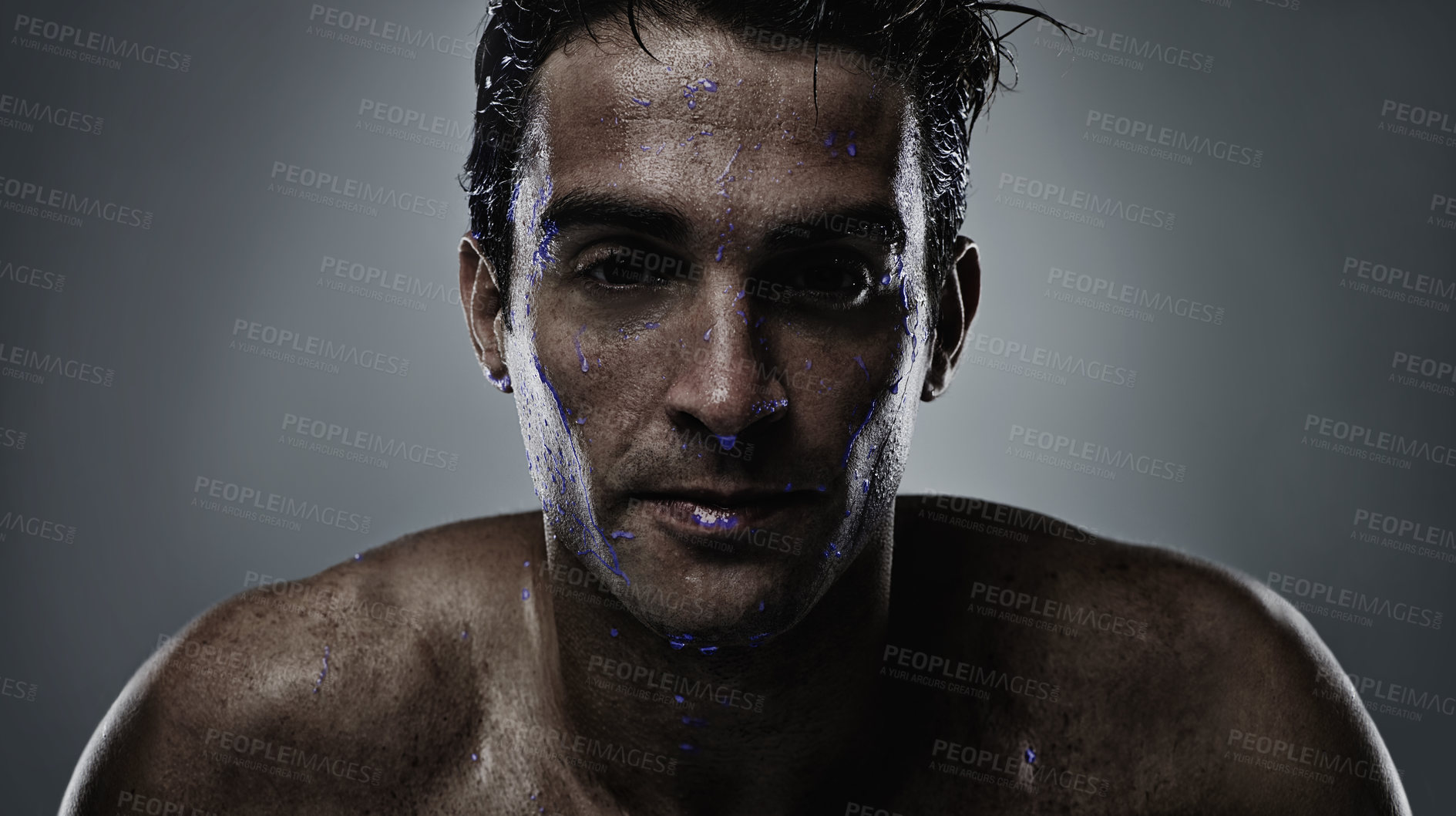 Buy stock photo Portrait, man and water with skincare, sweating and dermatology on a grey studio background. Face, person and purple liquid with hydration and beauty with morning routine, wet and luminescent with uv