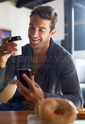 Buy stock photo Phone, smile and man with coffee at restaurant networking on social media, mobile app or internet. Happy, cappuccino and young male person scroll on website with cellphone with caffeine latte at cafe