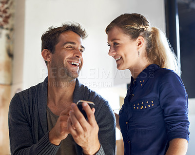 Buy stock photo Conversation, phone and young friends in cafe networking on social media, mobile app or internet. Smile, talking and people in discussion with cellphone for research in coffee shop or restaurant.