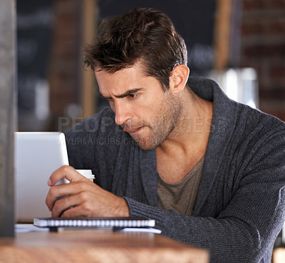 Buy stock photo Tablet, research and young man in cafe working on freelance creative project on the internet. Digital technology, reading and male designer freelancer on website for information in coffee shop.