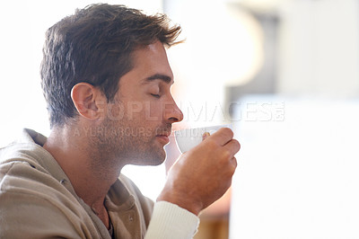 Buy stock photo Smelling, aroma and man with coffee in a cafe with calm, zen and relaxing attitude in morning. Caffeine, cappuccino and young male person enjoying scent of latte or espresso in mug at restaurant.