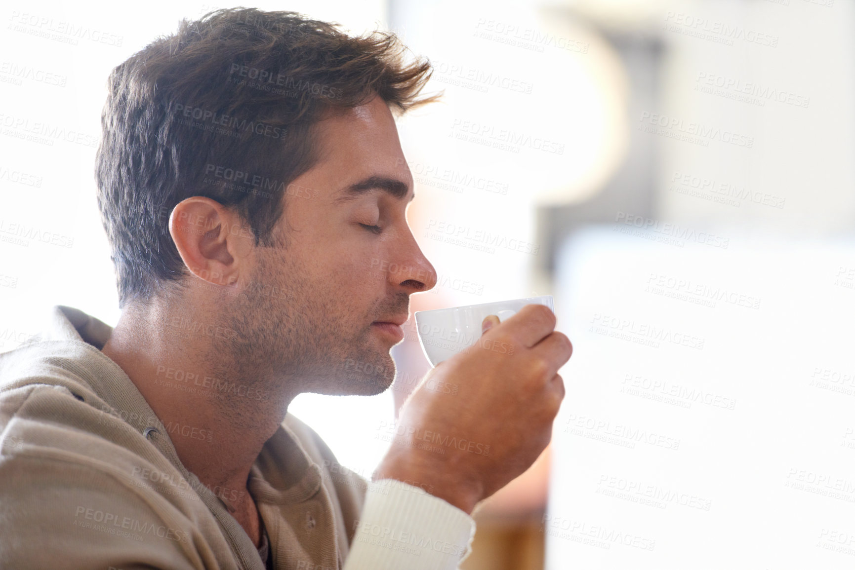 Buy stock photo Smelling, aroma and man with coffee in a cafe with calm, zen and relaxing attitude in morning. Caffeine, cappuccino and young male person enjoying scent of latte or espresso in mug at restaurant.