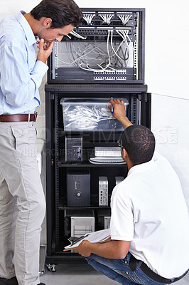 Buy stock photo Information technology, men and clipboard in server room for fixing, inspection and maintenance. Checklist, IT technician and computer in data center for cybersecurity, networking or database repair.