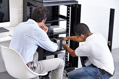 Buy stock photo Server room, man and technician working with electronics for hardware maintenance of glitch in office. IT support, worker and electrical engineer fixing internet connection for information technology