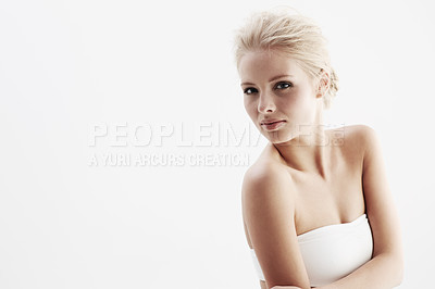 Buy stock photo Young woman, portrait and fashion in studio, confident and trendy style by white background. Blonde female model, face and pride for skincare, natural beauty and spa treatment in feminine clothes