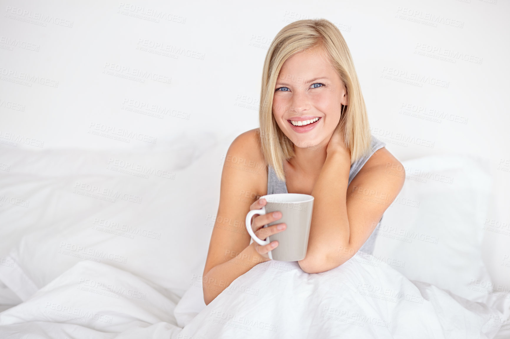 Buy stock photo Woman, portrait and drinking coffee in bed for morning relax or home beverage for comfort, peace or happy. Female person, face and smile with mug on duvet for warm caffeine or vacation, rest or tea