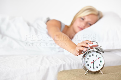 Buy stock photo Woman, bed and sleeping with alarm, wake up and dreaming in bed, resting and apartment in morning. Tired, blanket and exhausted on pillow, young female asleep in house on weekend with fatigue