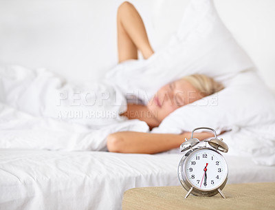 Buy stock photo Alarm, clock and woman frustrated to wake up in morning on bed in home with fatigue from rest. Press, snooze and girl angry with time and tired start to day in bedroom and routine in apartment
