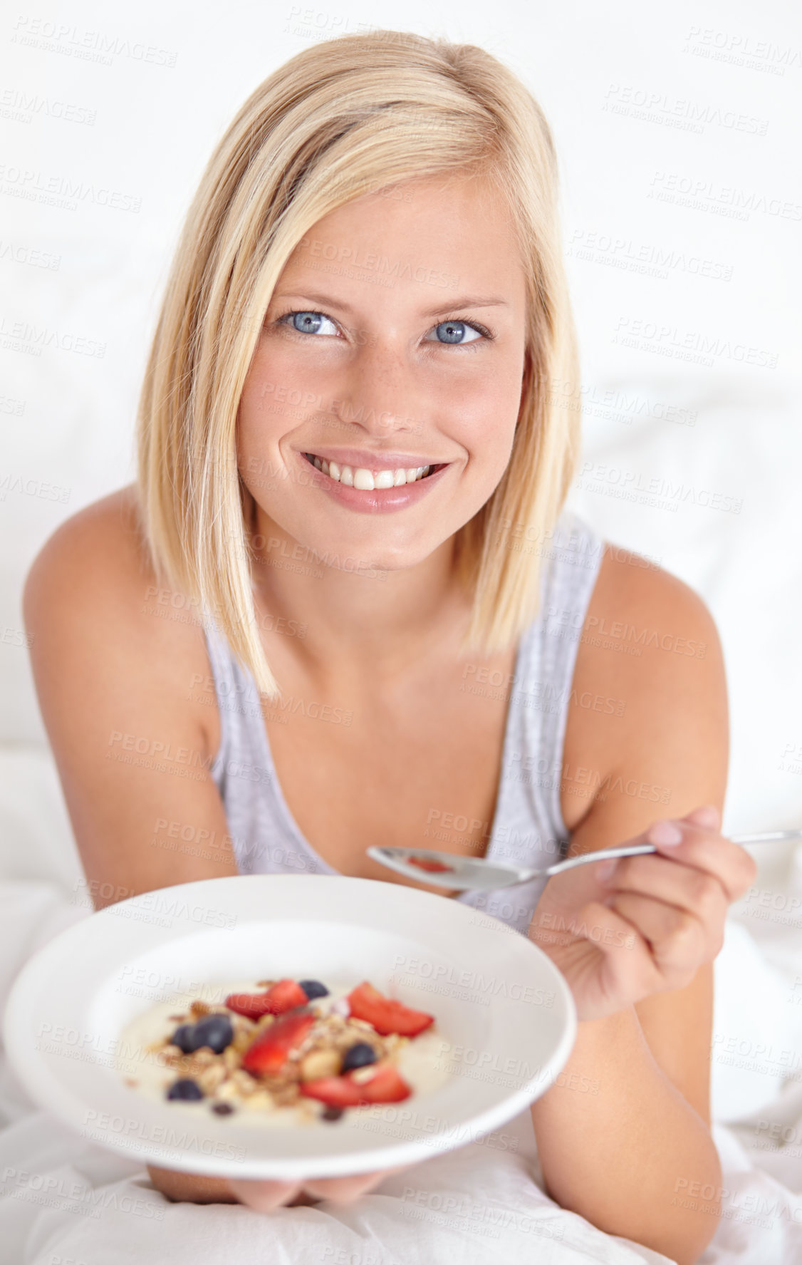 Buy stock photo Happy woman, portrait and breakfast in bed with muesli, meal or berries for balance, wellness or gut health at home. Fruit, eating or lady person face in bedroom for diet, nutrition or superfoods