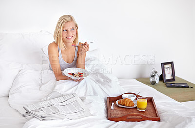 Buy stock photo Smile, thinking and food with woman in bed of hotel to wake up for morning hospitality or accommodation. Relax, breakfast and vacation with happy young blonde person in bedroom of home on weekend