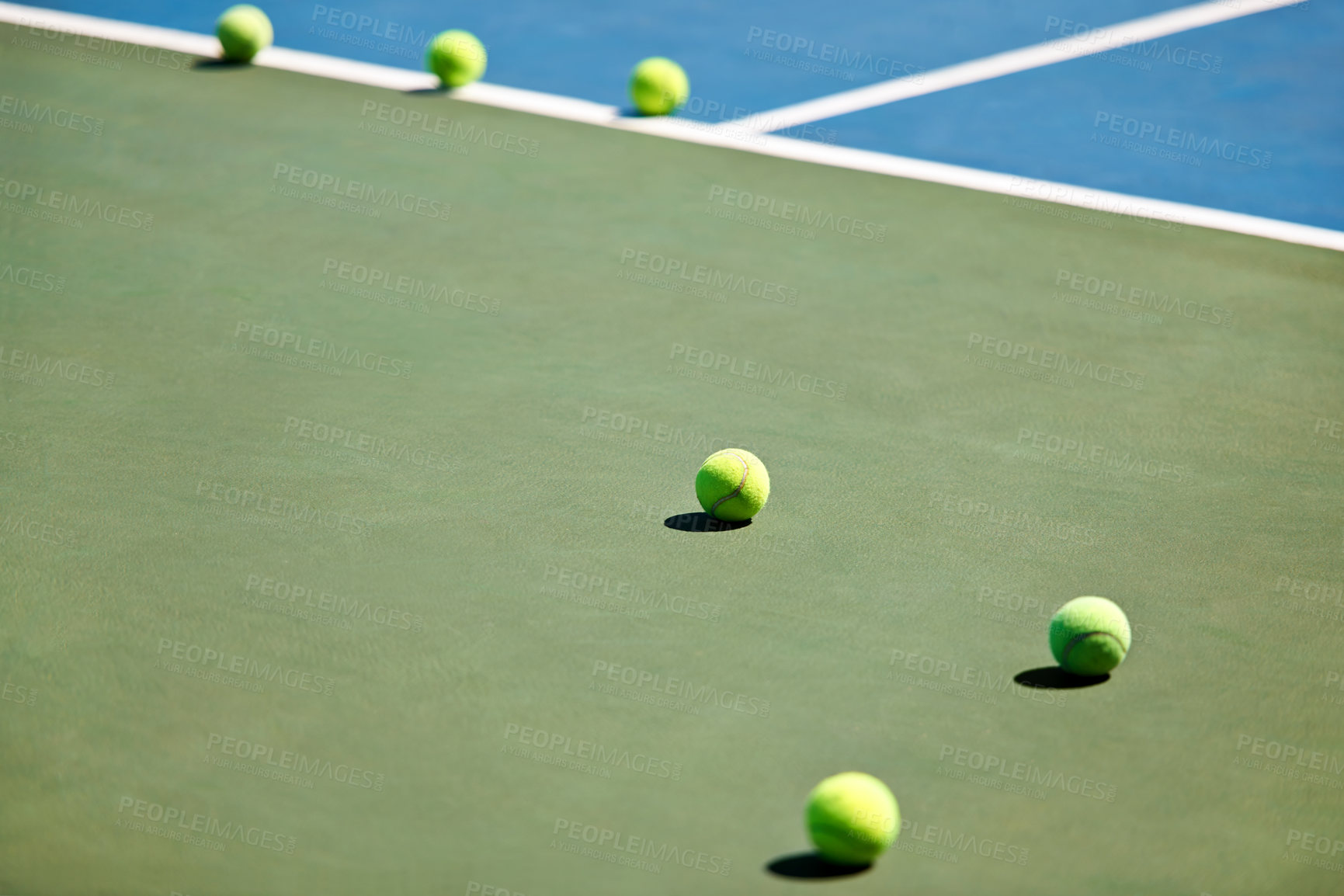 Buy stock photo Sport, fitness or tennis balls on court for training, exercise or competitive match to start in summer. Green, background or floor for health or hobby with equipment on the ground ready for a game