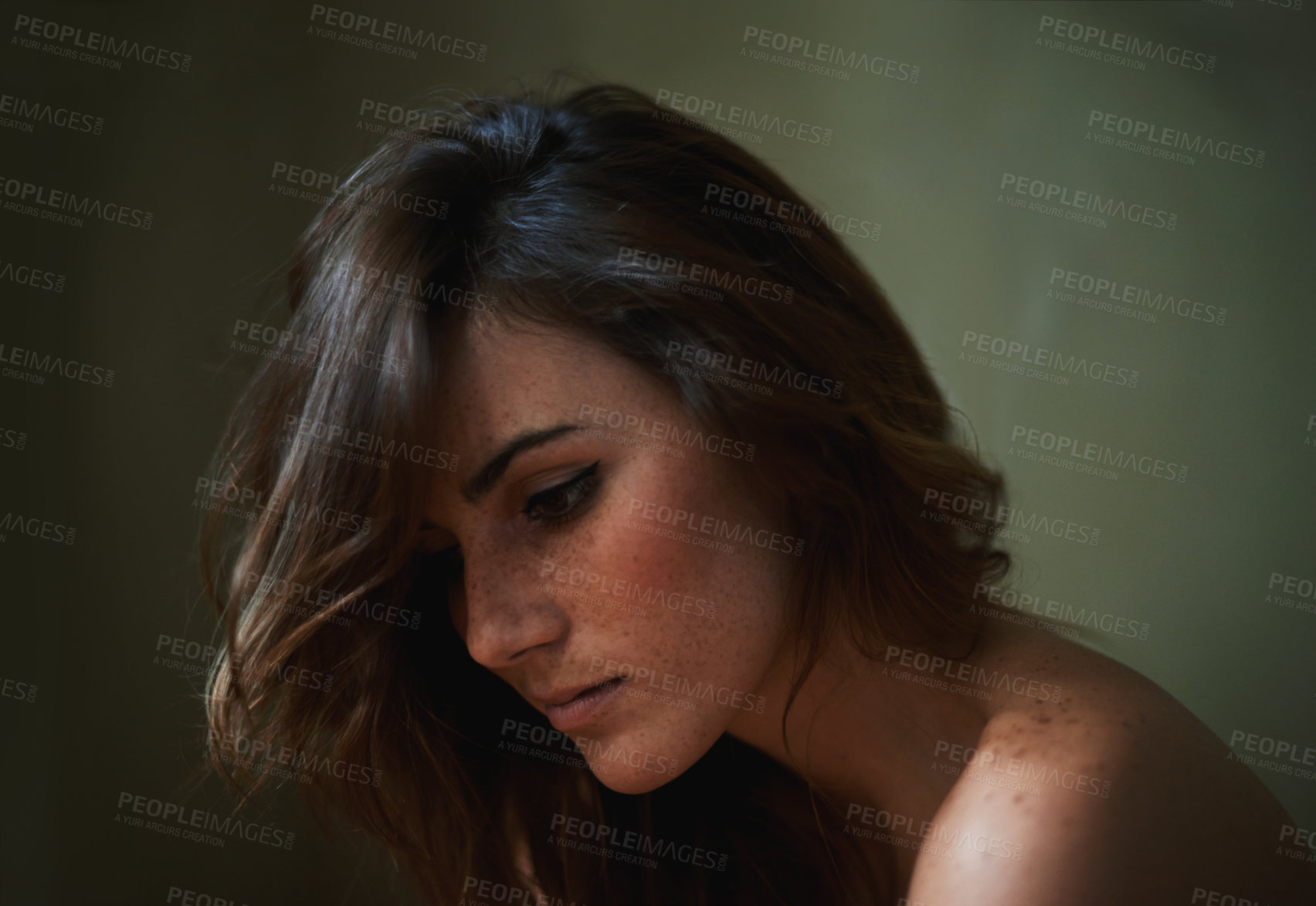 Buy stock photo Sad, depression and young woman in studio with upset, grief and mad facial expression for problem. Mental health, lonely and female person looking down with unhappy face for loss by gray background.