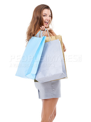 Buy stock photo Woman, shopping bags and portrait smile with wink standing isolated on a white studio background. Happy attractive female shopper carrying gifts and smiling in happiness for sale, discount or deal