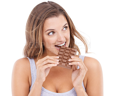 Buy stock photo Woman, eating chocolate and love candy with mouth , pleasure and craving sugar in white background. Hungry, snack and meal for comfort, dessert and sweets for calories, diet and satisfaction 