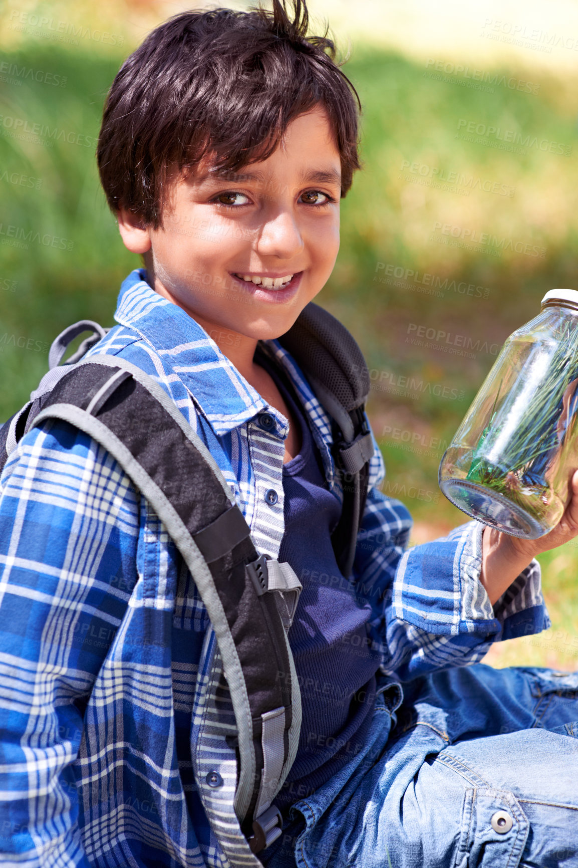 Buy stock photo Boy, child and smile with jar in nature, exploring and learning on adventure, hiking in park or woods for fun. Portrait, happy and young explorer, discovery and glass container for collecting bugs