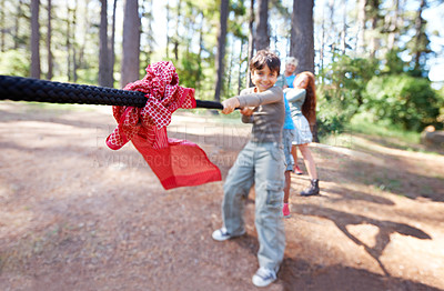 Buy stock photo Children, game and tug of war in forest, summer camp and holiday with travel and energy outdoor. Kids, adventure and team building with competition, playful and young people in group for fun