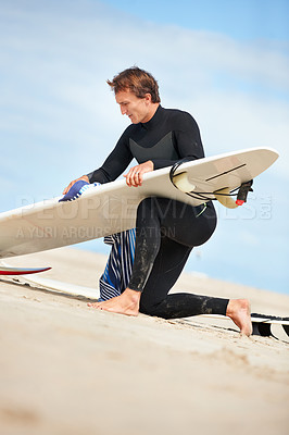 Buy stock photo A young man and his surfboard