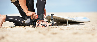 Buy stock photo Legs, strap for safety and surfer on beach for sports, fitness and training on travel vacation in summer. Hands, ankle and surfboard with person on sand by ocean or sea for surfing hobby or holiday