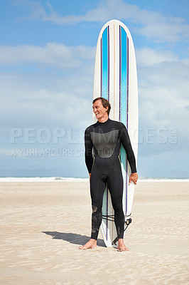 Buy stock photo full length shot of a surfer standing on the beach with his surfboard