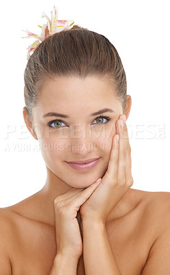 Buy stock photo Cropped portrait of a gorgeous young woman touching her face while posing against a white background