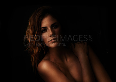Buy stock photo Woman, body and skincare portrait in studio for beauty, dermatology and shadow with light for art deco aesthetic. Cosmetics model or face of person with glow and shine on a dark or black background