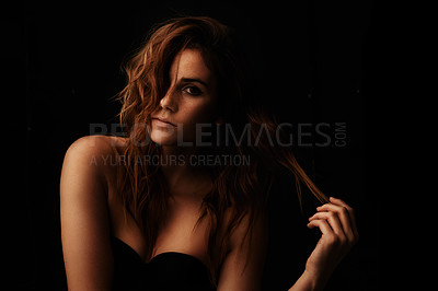 Buy stock photo Woman, hair care and ginger with portrait, serious and shampoo treatment in a studio. Relax, beauty and female person with wavy texture and fresh haircut with balayage coloring with black background
