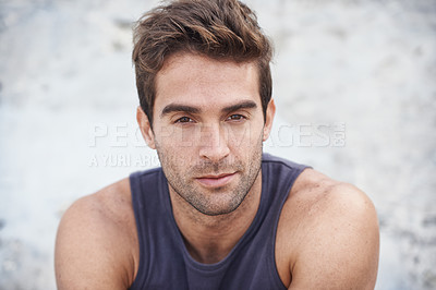 Buy stock photo Serious, fashion and portrait of young man with casual, cool and stylish outfit for confidence. Handsome, model and headshot of attractive male person with trendy style outdoor by wall in nature.