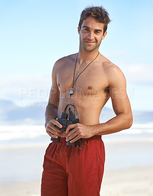 Buy stock photo Happy man, portrait and lifeguard on beach in security with binoculars for emergency in health and safety. Face of young male person smile in fitness for bay watch or patrol by the ocean coast or sea