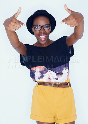 Buy stock photo A pretty and stylish african american woman posing for a studio shoot
