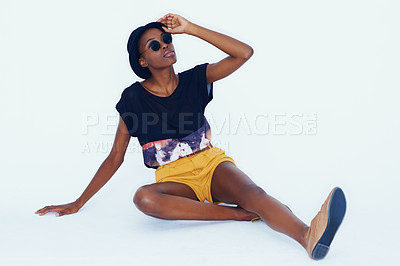 Buy stock photo Fashion, sunglasses and black woman on the floor, relaxing and hipster on a white studio background. African person, model and girl with stylish clothes and funky eyewear with mockup space and trendy
