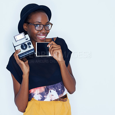 Buy stock photo Happy woman, polaroid and portrait in studio with camera, creativity and media for artist with creative talent. Young photographer, happiness and face by vintage image and focus by white background