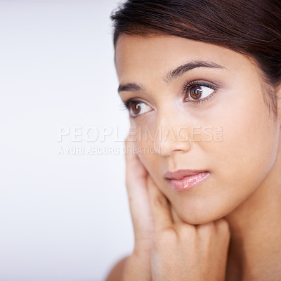 Buy stock photo Close up shot of beautiful young woman touching her face