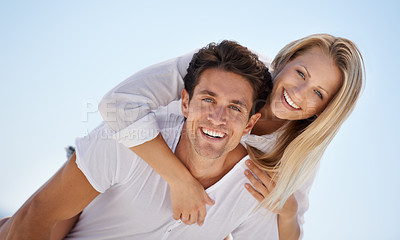 Buy stock photo Portrait, hug and happy couple on blue sky for date, outdoor bonding and tropical holiday. Romance, man and woman in nature, piggy back and relax on vacation together with travel, care and adventure.